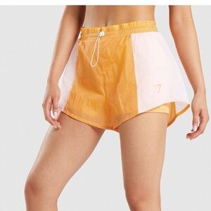 Gymshark Pulse 2-in-1 Shorts – Size S (Apricot Orange/White)